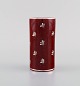 Wilhelm Kåge for Gustavsberg. Rare red cylindrical argenta art deco vase in 
glazed ceramics with silver inlay. Sweden 1930 / 40s.
