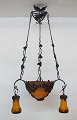 Muller Frères, Luneville. Large impressive art nouveau chandelier in wrought 
iron designed with foliage with four screens in mouth-blown Pâte-de-verre art 
glass. Early 20th century.
