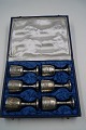 Box with 6 silver plated drinking cups 9.5cms on a 

round foot