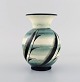 Ilse Claesson for Rörstrand. Rare vase in glazed ceramics. Leaves on green and 
cream colored background. 1920 / 30s.
