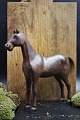 Decorative, old Swedish horse from around the year 1900 in carved wood with fine 
paint, small leather ear and with a fine patina.
H:25cm. L:25cm.