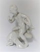 Bing & Grøndahl. Porcelænsfigur. Kai Nielsen. Havbarn på delfin, blanc de chine. 
Højde 18 cm. (1 sortering)