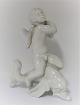 Bing & Grondahl. Porcelain figure. Kai Nielsen. Sea child on dolphin, blanc de 
chine. Height 20 cm. (1 quality)