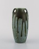Denbac, France. Vase with handles in glazed ceramic. Beautiful running glaze in 
shades of blue and green. 1940