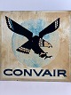 Metal-del fra fly - nu skilt - med logo af ørn fra det amerikanske CONVAIR, som både har lavet fly og dele til raketter - midten af det 20. århundrede