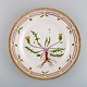 Royal Copenhagen Flora Danica dinner plate in hand-painted porcelain with 
flowers and gold decoration. Model number 20/3549.
