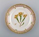 Royal Copenhagen Flora Danica side plate in hand-painted porcelain with flowers 
and gold decoration. Model number 20/3552.
