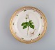 Royal Copenhagen Flora Danica salad plate in hand-painted porcelain with flowers 
and gold decoration. Model number 20/3573.
