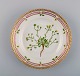 Royal Copenhagen Flora Danica salad plate in hand-painted porcelain with flowers 
and gold decoration. Model number 20/3573.
