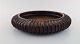 Arne Bang. Large round dish in glazed ceramics. Ribbed design. Model number 154. 
Beautiful glaze in brown shades. 1940