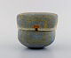 Gunhild Aaberg, Danish contemporary ceramist. Unique lidded jar in stoneware 
with yellow patterned decoration. 1980