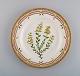 Royal Copenhagen Flora Danica dinner plate in hand-painted porcelain with 
flowers and gold decoration. Model number 20/3549.
