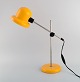 Svensk designer. Justerbar retro skrivebordslampe i gult lakeret metal og krom. 
1970