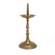 An early 17th century brass candlestick. H: 36cm