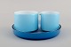 Michael Bang for Holmegaard. Palet Sugar / creamer set on serving tray in light 
blue mouth blown art glass. Mid-20th century.
