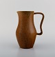 Arne Bang (1901-1983), Denmark. Jug in glazed ceramics. Beautiful glaze in brown 
shades. 1940s / 50s.

