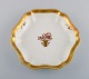 Royal Copenhagen Golden Basket dish in porcelain with flowers and gold 
decoration. Dated 1969-1974.

