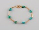 Scandinavian jeweler. Bracelet in 18 carat gold with turquoises. Mid-20th 
century.
