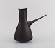 Dame Lucie Rie (b. 1902, d. 1995) Austrian-born British ceramist. Stylish 
Pitcher in black glazed ceramics. Own workshop, approx. 1970.

