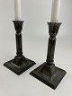 Pair of Just Andersen candlesticks in disco metal. 
Lots of patina