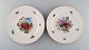 KPM, Berlin. Two antique porcelain plates with hand-painted flower baskets and 
gold edge. Early 20th century.
