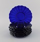 Monica Bratt for Reijmyre. 10 plates in blue mouth blown art glass. Wavy design. 
Mid-20th century.
