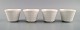 Wilhelm Kåge for Gustavsberg. Four flower pot covers in porcelain. Swedish 
design, 1960s.
