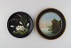 Two antique Hjorth decorative plates in hand-painted teracotta. Late 19th 
century.
