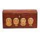 An early 19th century original decorated wooden box with wood cut faces. Denmark 
circa 1800. H: 14cm. L: 26cm. D: 13cm