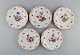 Five antique Meissen porcelain plates with hand-painted flowers and gold 
decoration. Late 19th century.
