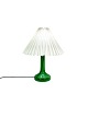 Table lamp of green glass with paper shade, by Holmegaard. 
5000m2 showroom.
Great condition
