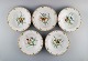 Five antique Royal Copenhagen deep plates in porcelain with hand-painted 
flowers, butterflies and gold edge. Mid-19th century.
