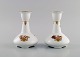 Two Royal Copenhagen Golden Basket candlesticks in porcelain with flowers and 
gold decoration. Model number 595/430.
