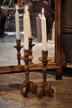 A pair of old French wooden candlesticks with old gold plating 
and a fine patina. Height:26cm.