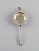 European silversmith. Antique silver tea strainer. 1800s.
