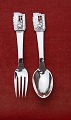 The little Match-Seller children's cutlery of 
Danish solid silver. Set spoon & fork