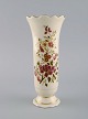 Zsolnay vase in cream-colored porcelain with hand-painted flowers and gold 
decoration. Late 20th century.
