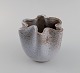 European studio ceramicist. Unique wavy edged vase in glazed stoneware. 
Beautiful speckled glaze. 1960s / 70s.
