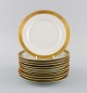 Royal Copenhagen service no. 607. 11 porcelain cake plates. Gold border with 
foliage. Model number 607/9588. Dated 1944.
