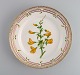 Royal Copenhagen Flora Danica lunch plate in hand-painted porcelain with flowers 
and gold decoration. Model number 20/3550.
