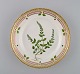 Royal Copenhagen Flora Danica salad plate in hand-painted porcelain with flowers 
and gold decoration. Model number 20/3573.
