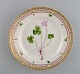 Royal Copenhagen Flora Danica salad plate in hand-painted porcelain with flowers 
and gold decoration. Model number 20/3573.
