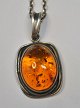 Amber pendant 
in sterling 
silver, 20th 
century
