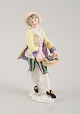 Presumably German porcelain figure, man with flower basket, 19th century.