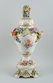 Dresden, Germany. Colossal lidded  porcelain vase on stand.
Lavishly decorated with flowers in relief, hand painted.
