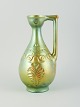 Zsolnay, Ungran. Stor keramik-kande med eosin-glasur modelleret med bladværk.