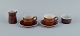 Stig Lindberg for Gustavsberg, COQ, two coffee cups with saucers, cream jug and 
sugar bowl.