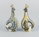 Jean Delima for Keraluc, Quimper, France, a pair of large faience pitchers 
shaped like roosters. In style of Picasso.