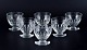 Baccarat, France, a set of six "Charmes" Art Deco white wine glasses in clear 
crystal glass. Faceted cut.