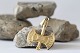 Gold jewelery shaped like a battle axe, in 14 carat gold, with many details.
SOLD